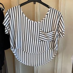 Striped cropped top with pocket and longer back.